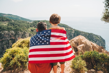 children wearing American flag on their backs